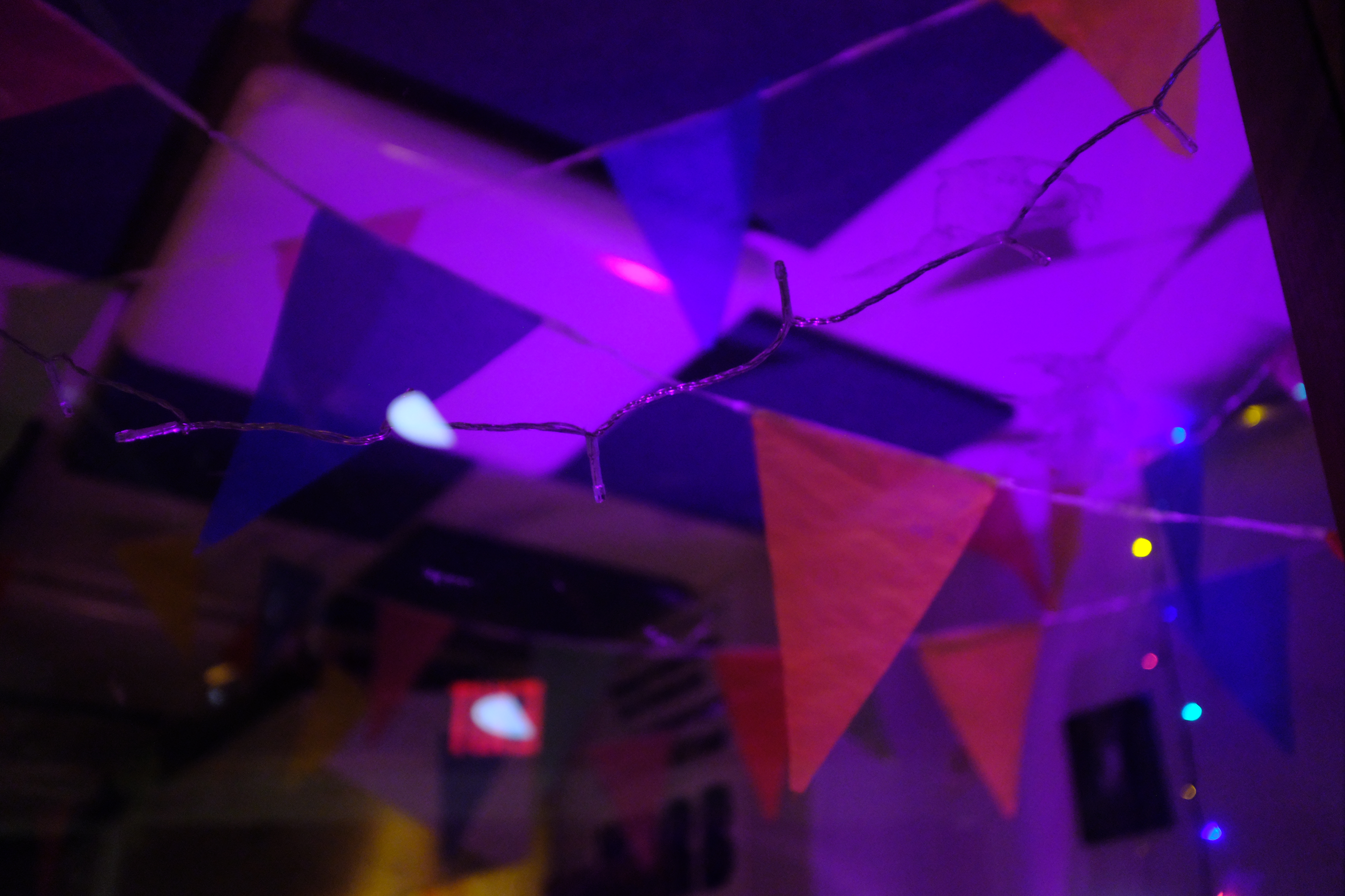 Colorful firelight and flags on ceiling. 